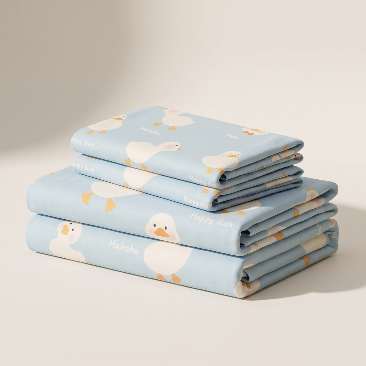 Puddle Sheet Set, folded stack, little ducks on pale blue