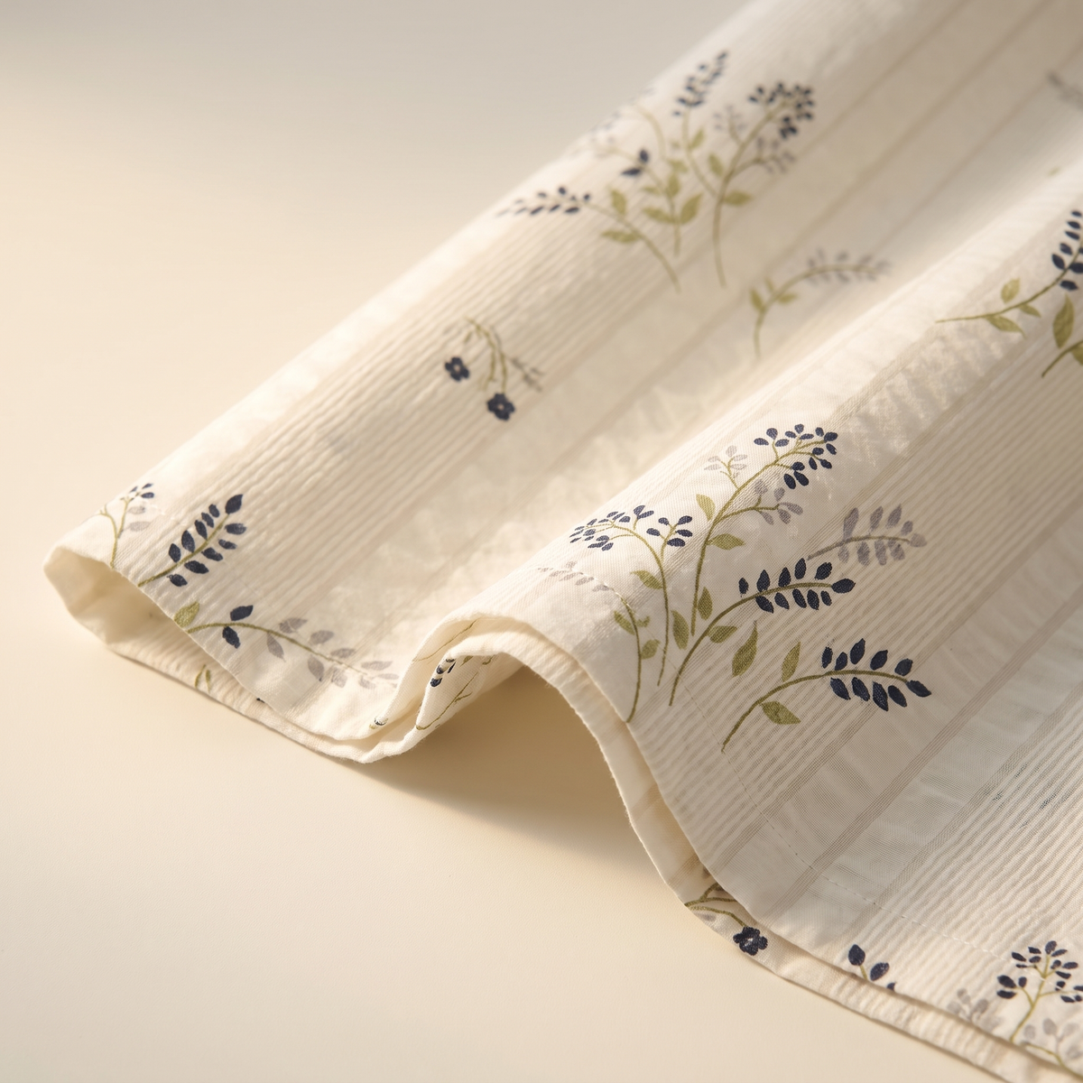 Heather Sheet Set, fold detail, thyme and heather in gray-green on cream
