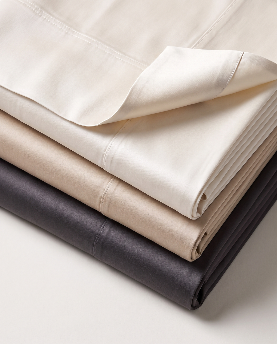 Folded Royal sateen sheets in neutral shades