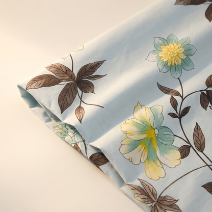 Azure Sheet Set, fold detail, yellow blooms on sky blue