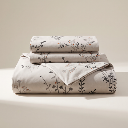 Willow Duvet Cover Set, folded stack, dark wildflower stems on warm stone
