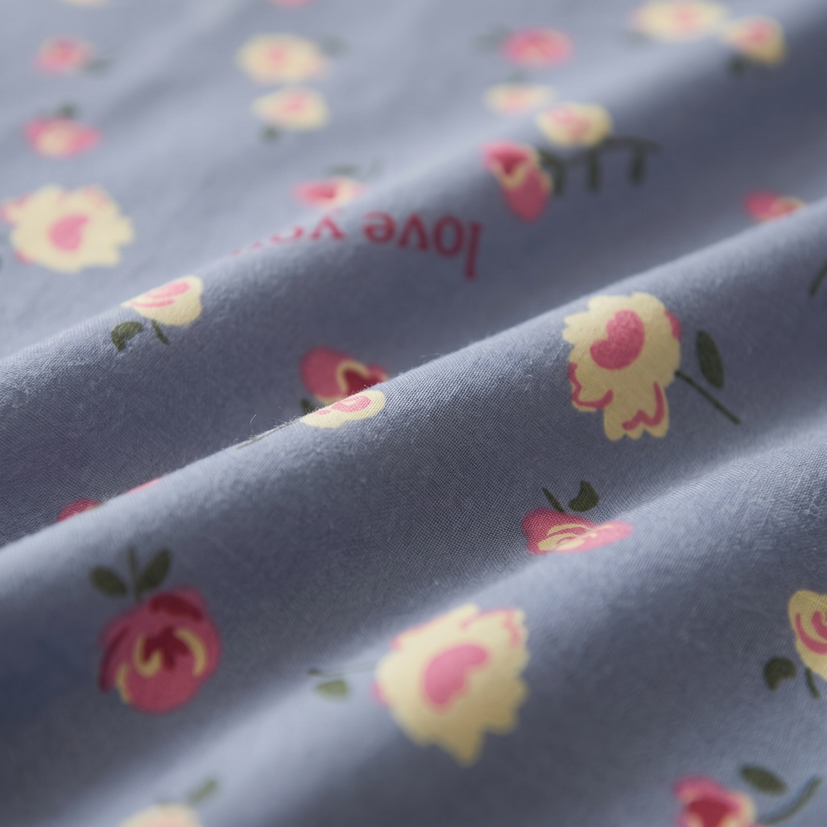 Amour Duvet Cover Set, fabric close-up, small roses and hearts on dusty blue