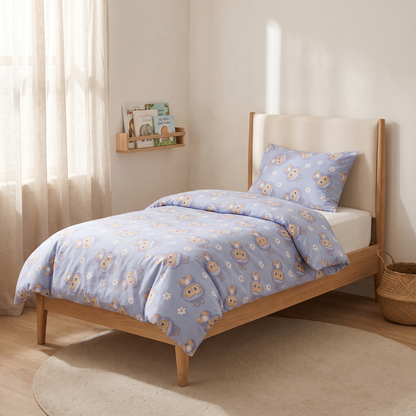 Burrow Duvet Cover Set, made bed, rabbits and daisies on periwinkle