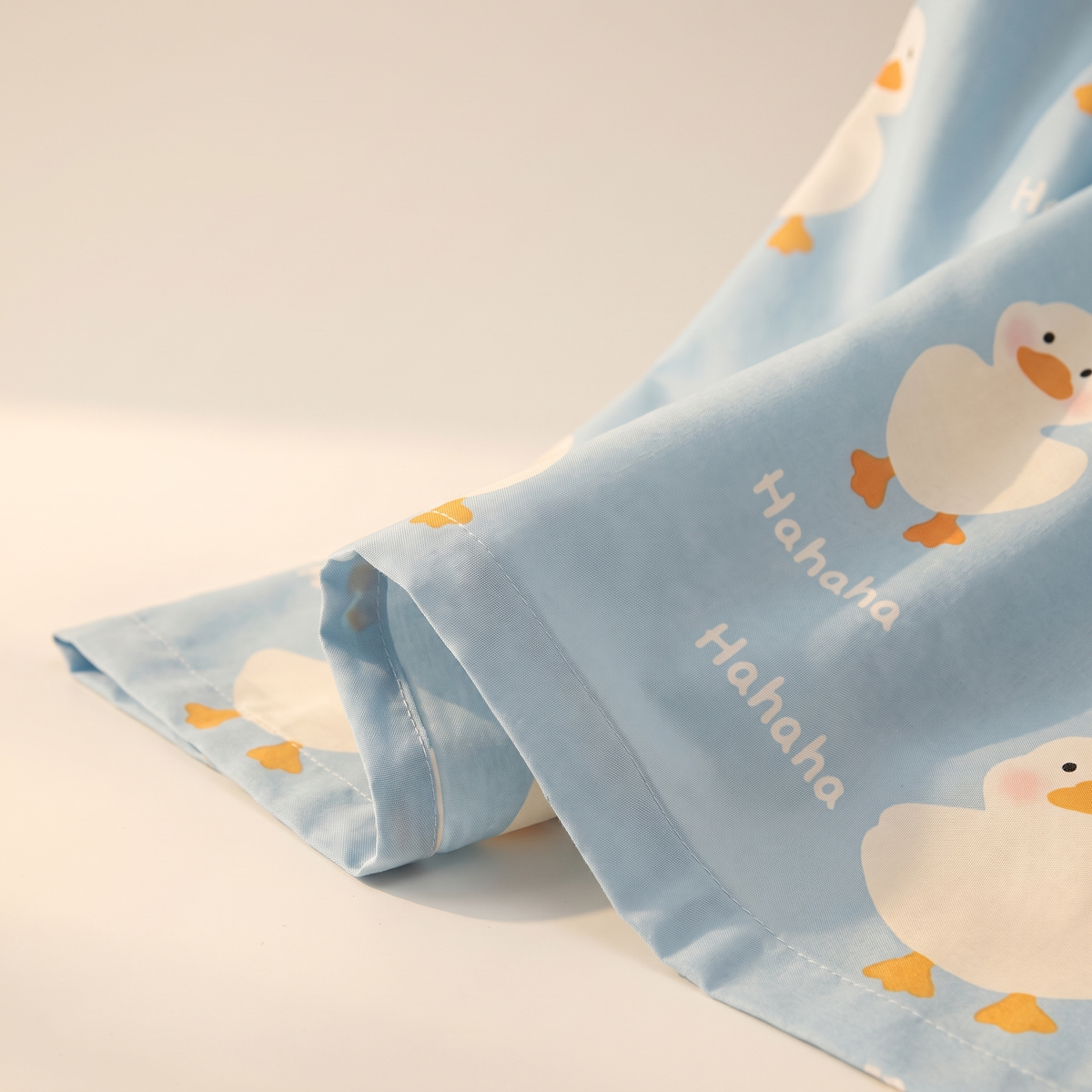 Puddle Sheet Set, fold detail, little ducks on pale blue