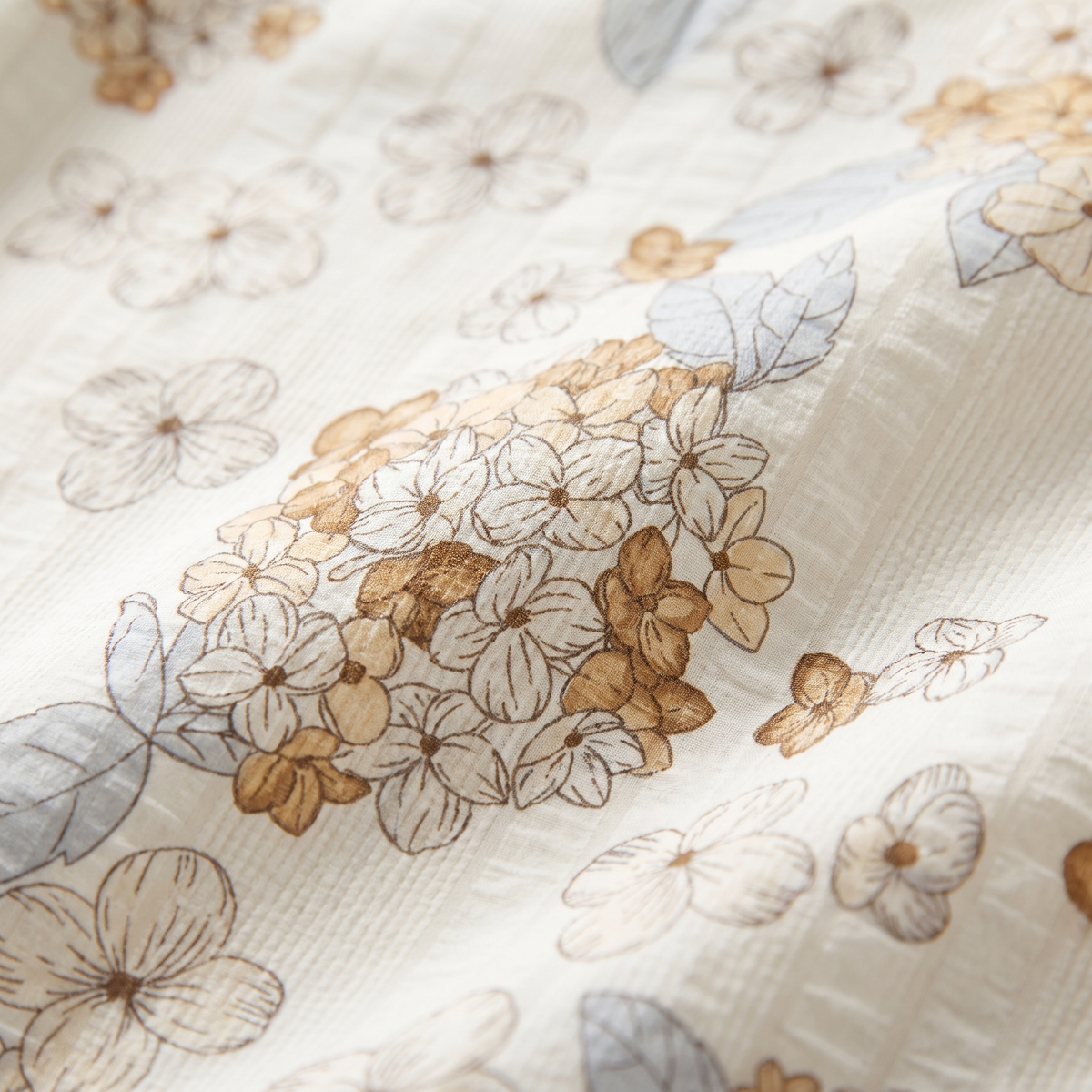 Petal Sheet Set, fabric close-up, tan and white cherry blossom on cream