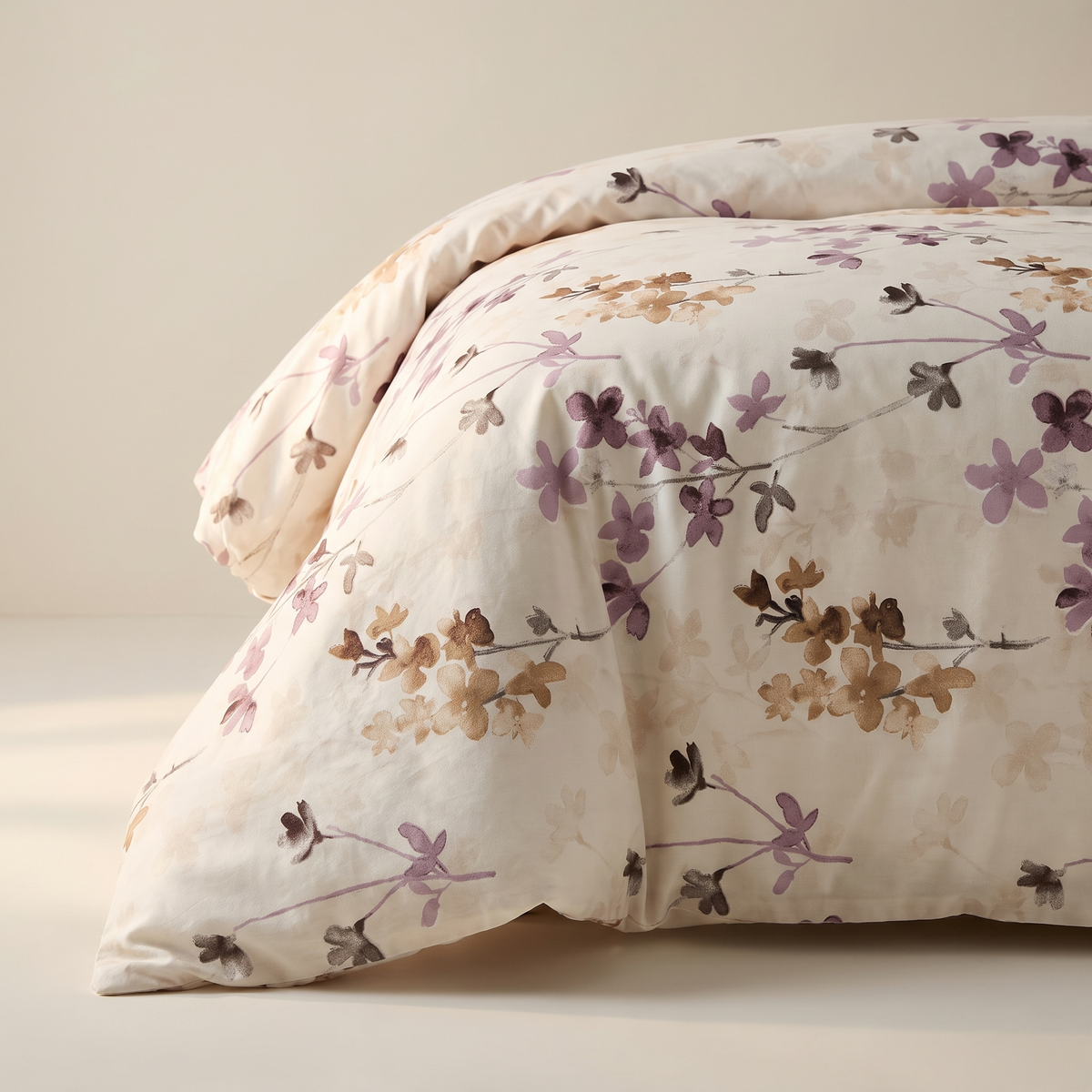 Blossom Duvet Cover Set, fold detail, plum and mauve blossoms on cream