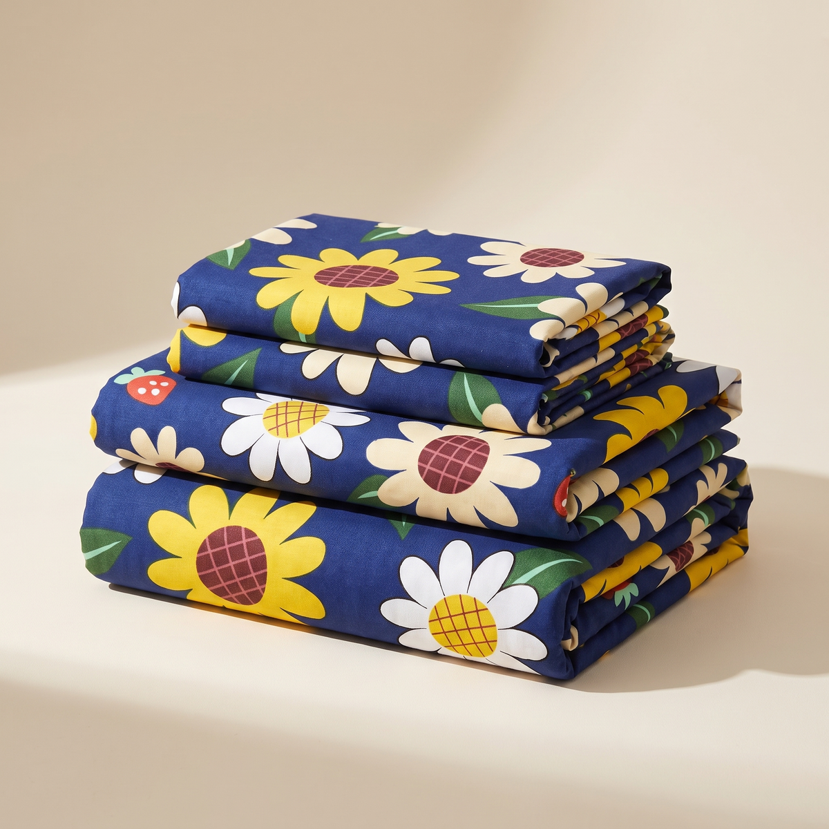 Sunny Sheet Set, folded stack, sunflowers and daisies on navy