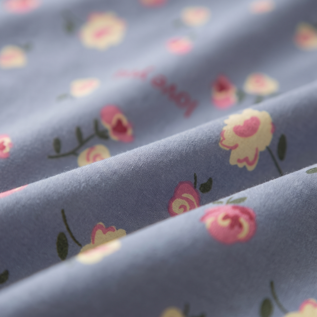 Amour Sheet Set, fabric close-up, small roses and hearts on dusty blue