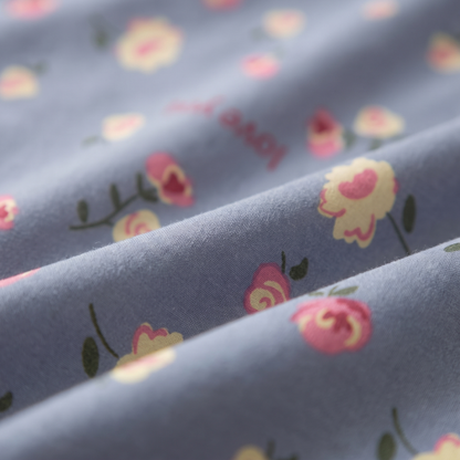 Amour Sheet Set, fabric close-up, small roses and hearts on dusty blue