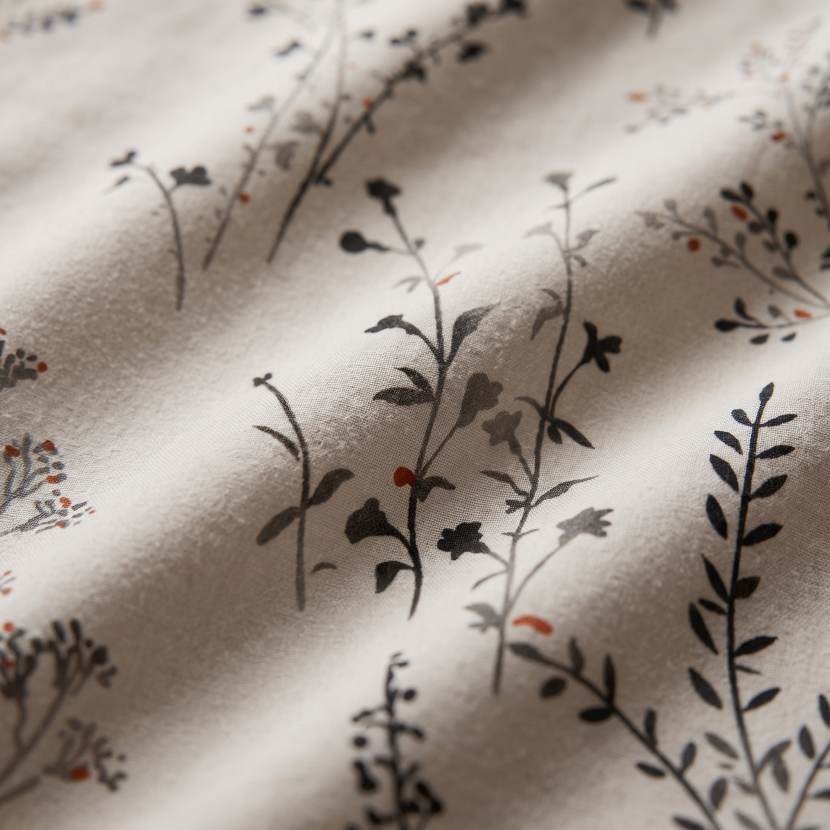 Willow Sheet Set, fabric close-up, dark wildflower stems on warm stone
