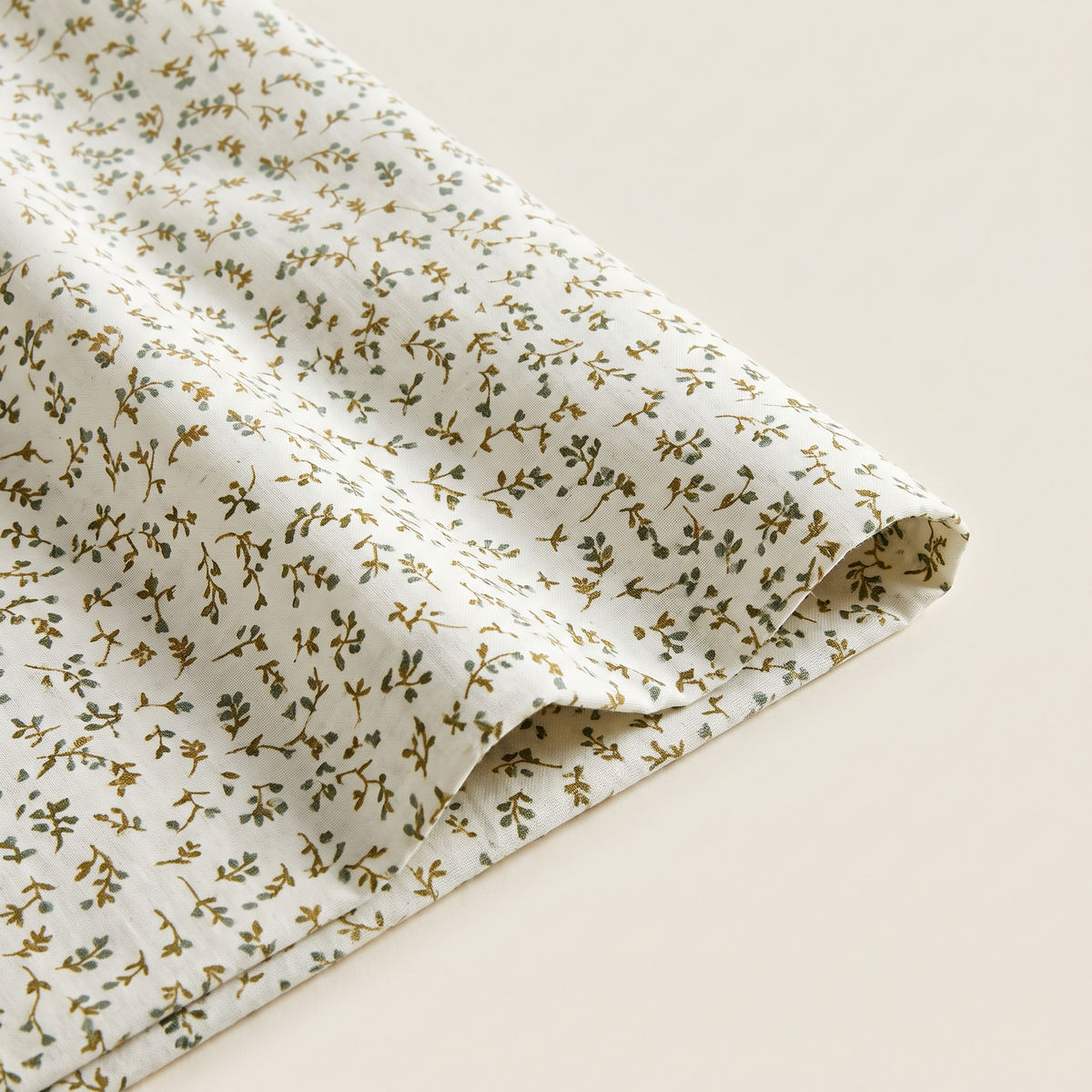 Olive Sheet Set, fold detail, olive leaf print on ivory