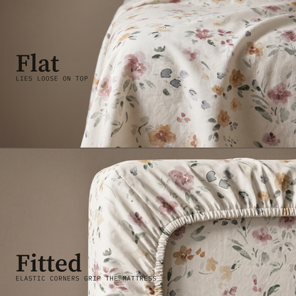 Meadow Sheet Set, flat and fitted sheet side by side, watercolor wildflowers in rose and amber