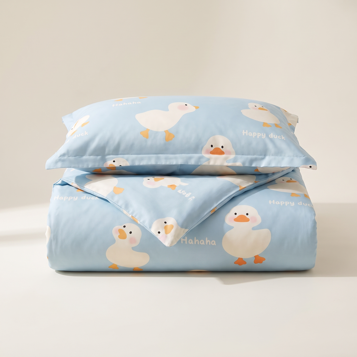 Puddle Duvet Cover Set, folded stack, little ducks on pale blue