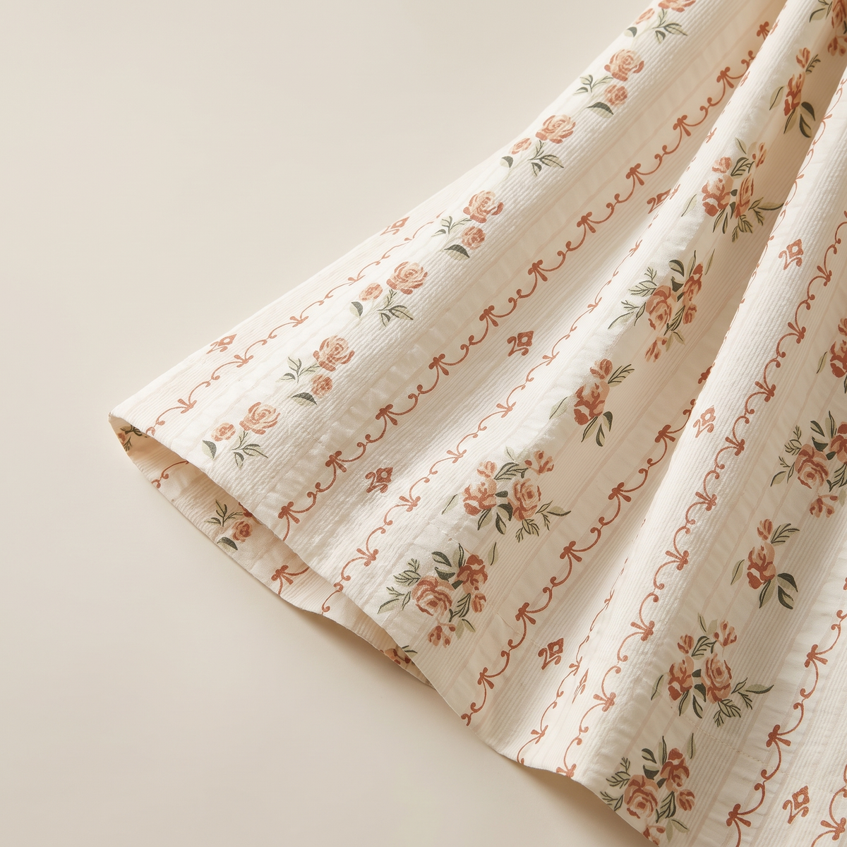 Rosette Sheet Set, fold detail, small coral roses on vines