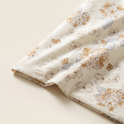 Petal Duvet Cover Set, fold detail, tan and white cherry blossom on cream