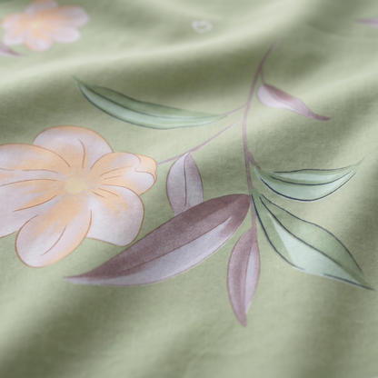 Lotus Sheet Set, fabric close-up, pale pink lotus flowers on sage green