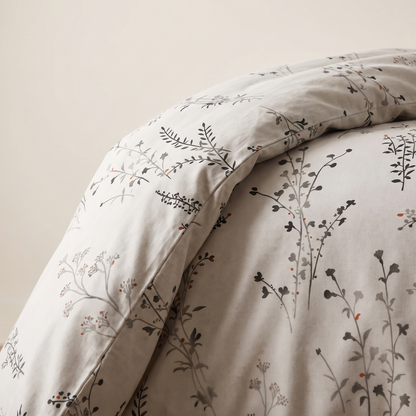 Willow Duvet Cover Set, fold detail, dark wildflower stems on warm stone