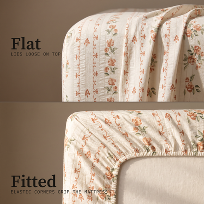 Rosette Sheet Set, flat and fitted sheet side by side, small coral roses on vines