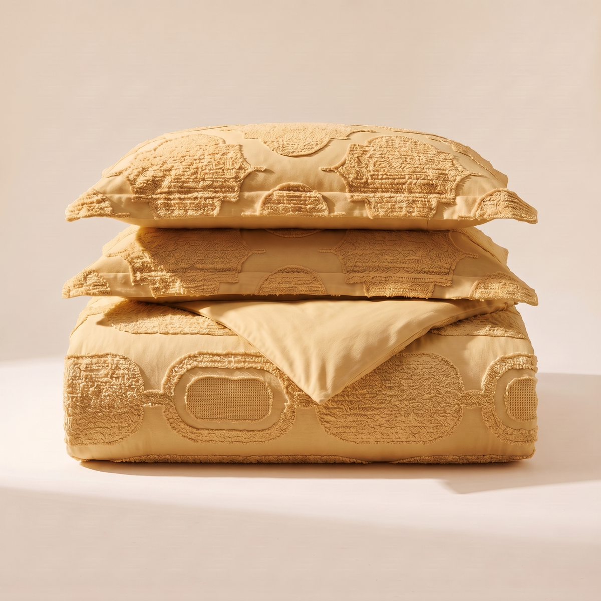 Honeycomb Duvet Cover Set, folded stack, honey gold with a raised honeycomb