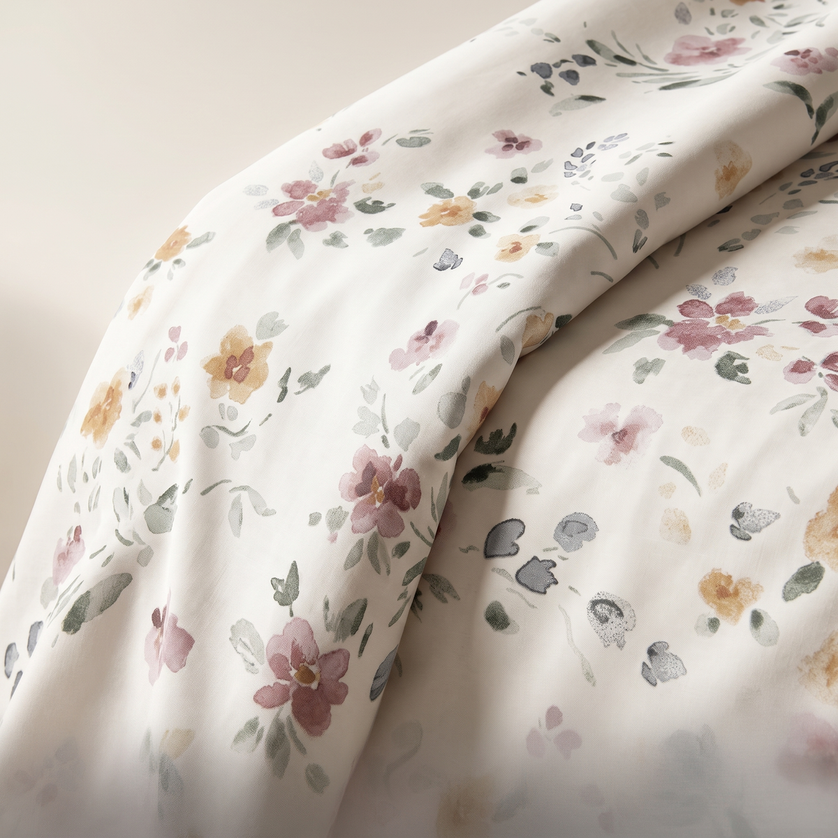 Meadow Sheet Set, fold detail, watercolor wildflowers in rose and amber